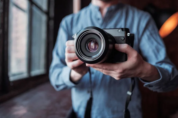 Camera in hand. Close-up of hand holding camera — Stock Photo, Image