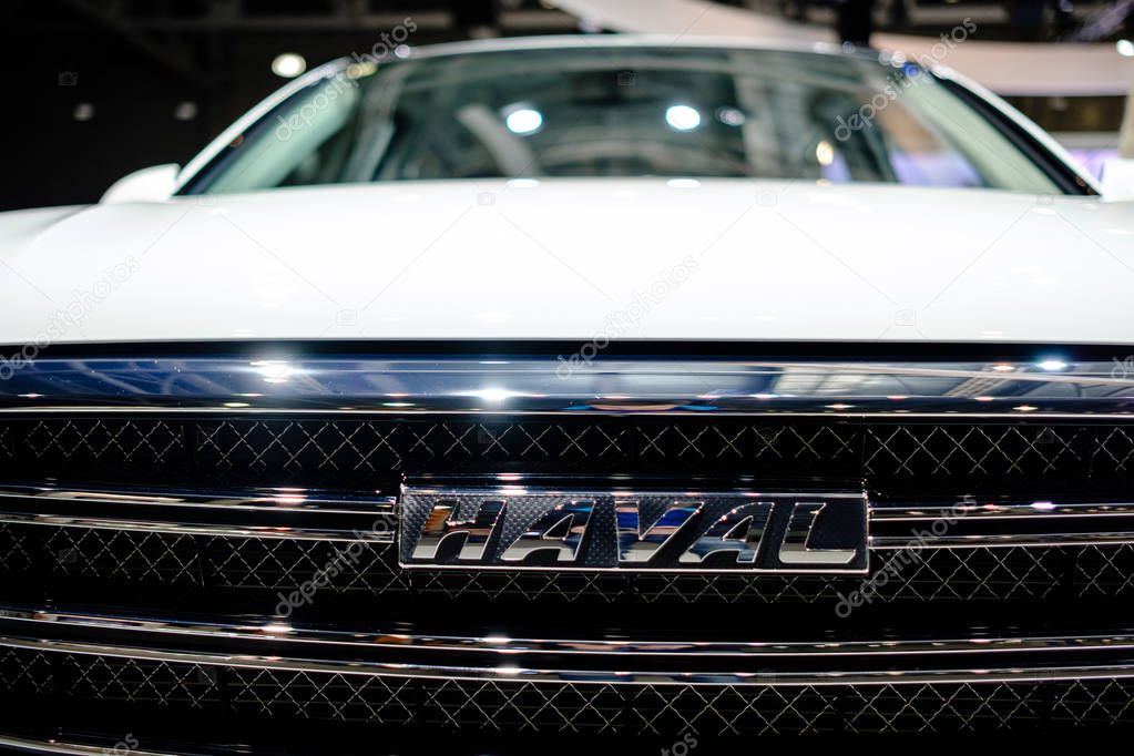 MOSCOW, SEPTEMBER 31, 2018: The newest HAVAL car on automotive exhibition stand on MMAC 2018. Automobile show of family personal cars. World last automotive developments and achivements. close logo