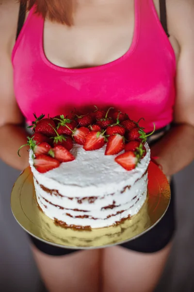 Portrait of woman eating natural cake at home