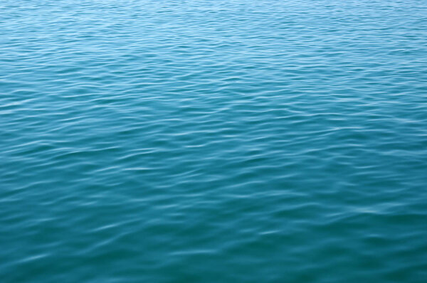 Blue sea surface with waves . Water background.