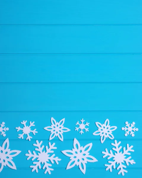 Νιφάδες Χιονιού Και Αστέρια Μπλε Ξύλινο Φόντο — Φωτογραφία Αρχείου
