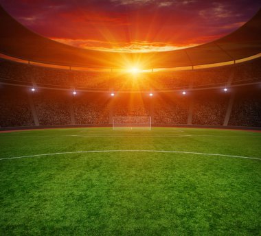 Parlak ışıkları olan futbol stadyumu.