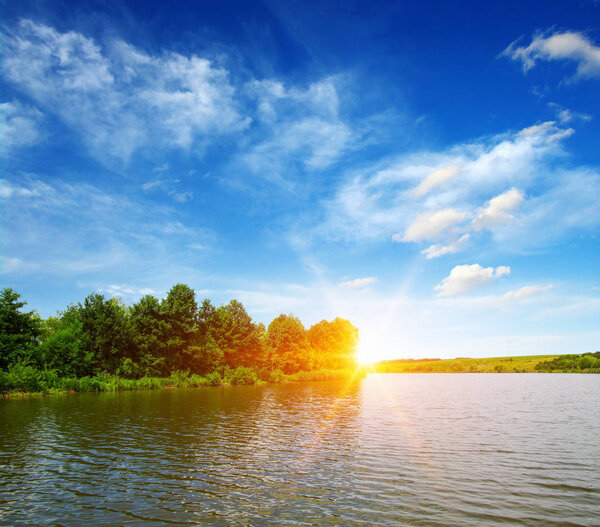 Lake water, shore and sun.