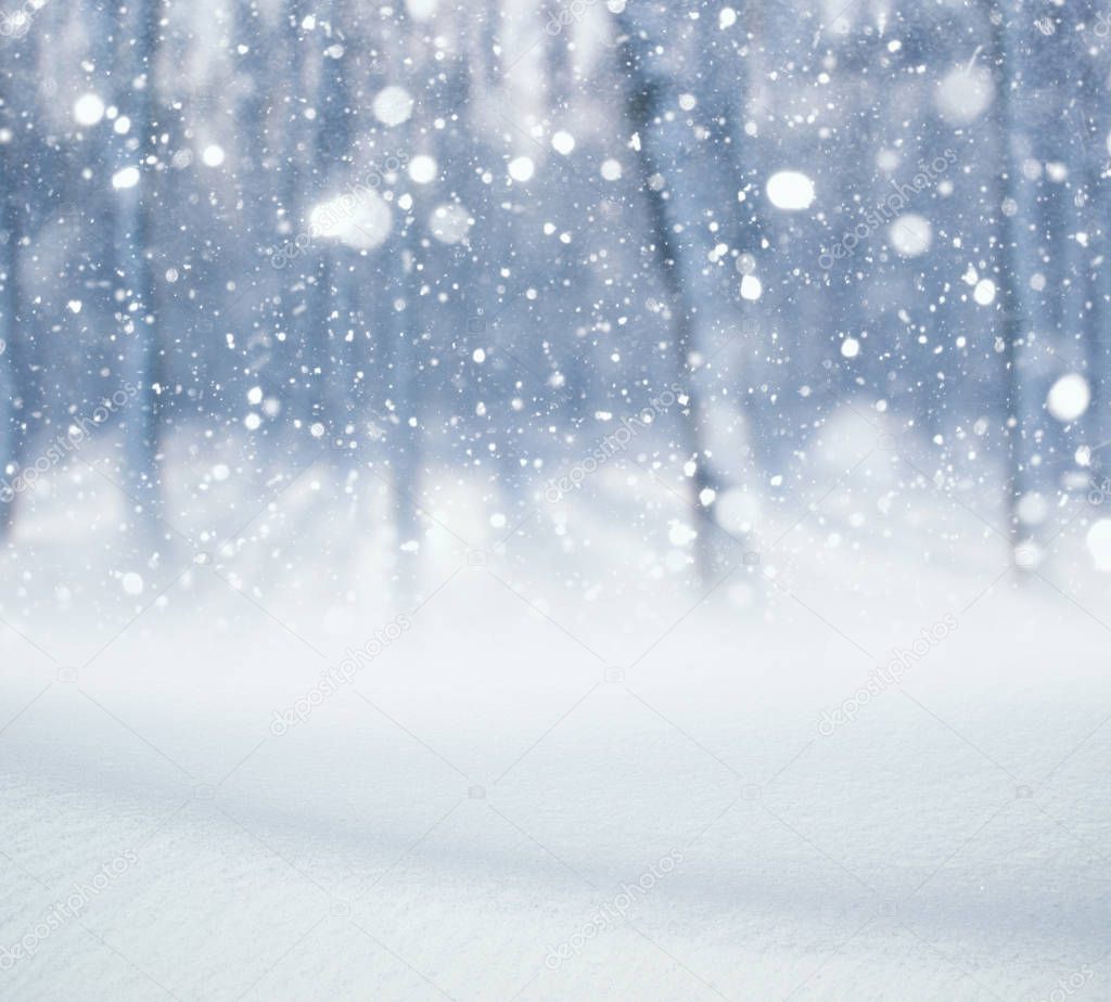 Winter background, falling snow over winter landscape with copy space