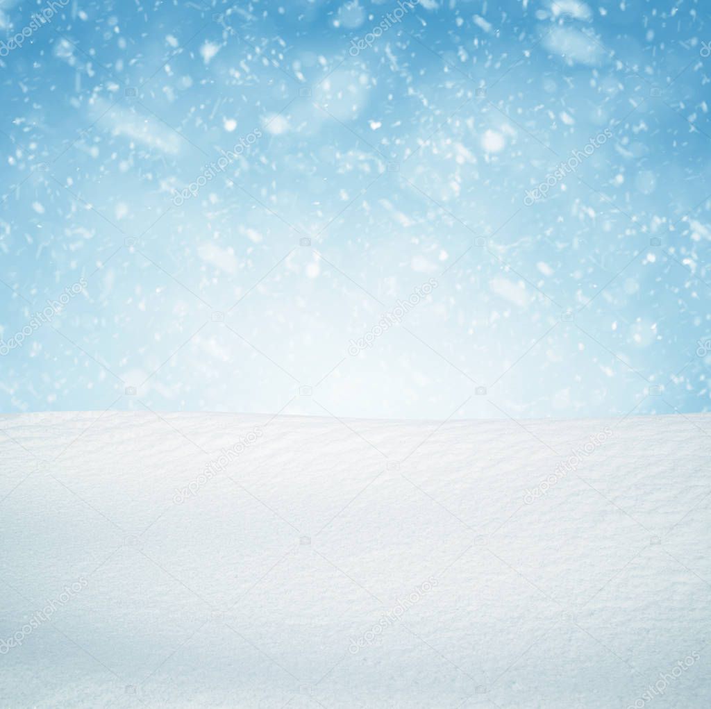 Winter background, falling snow over winter landscape with copy space