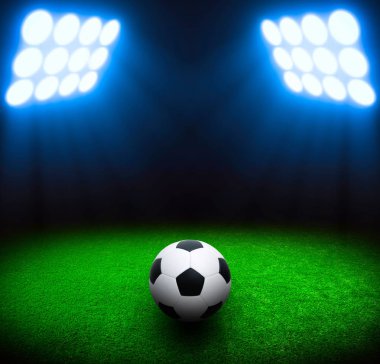Futbol topu yeşil stadyumda, arena gece aydınlandı parlak spot ışıkları