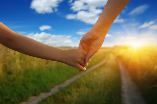 Hands Holding Each Other Field Road Sun — Stock Photo, Image
