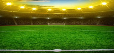 Parlak ışıkları olan futbol stadyumu.