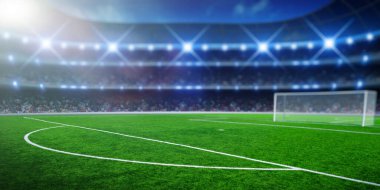 Işıklı futbol stadyumu, yeşil çimenler ve gece bulanık gökyüzü