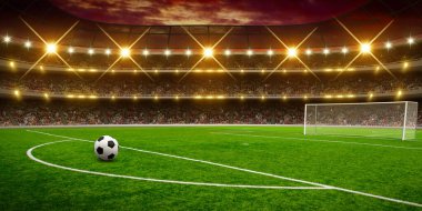Stadyumda futbol topu, gece arenasında spot ışıkları