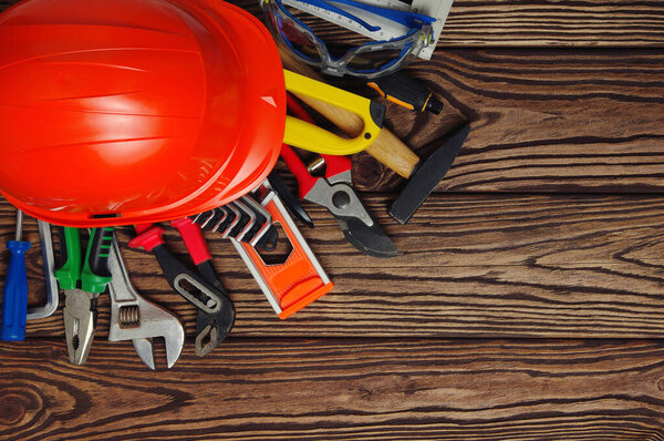 Tools on wood  background . Top view.