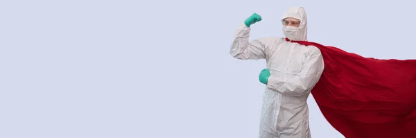 A doctor in a costume of a super hero stands on defense against a viral pandemic