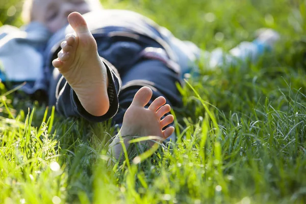 Happy Little Boy Lying Green Grass Outdoors Spring Park — Stock Photo, Image