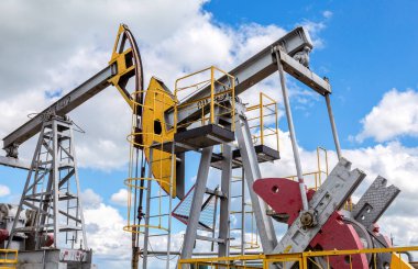 Tatarstan, Russia - June 10, 2018: Working pump jack fracking crude extraction machine. Oil industry equipment clipart