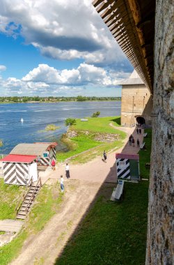 Shlisselburg, Russia - August 8, 2018: Historical fortress Oreshek is an ancient Russian fortress. View of the Neva river and ticket centre for visitors of museum clipart