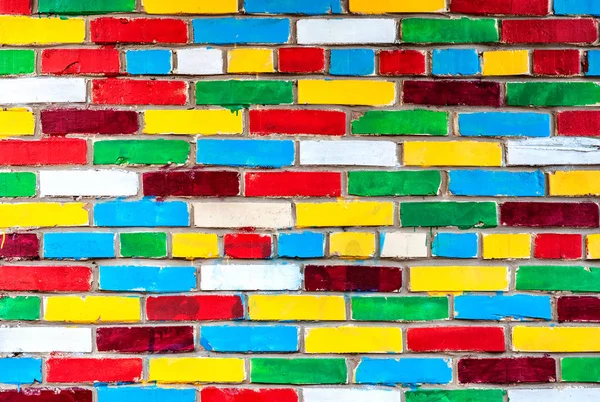 Veelkleurige bakstenen muur als een creatieve achtergrond — Stockfoto