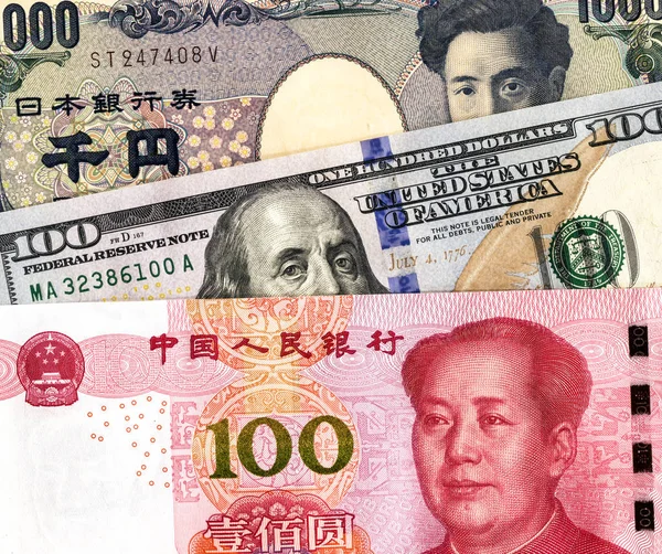 Japanese yen banknote, american dollar and chinese yuan — Stock Photo, Image