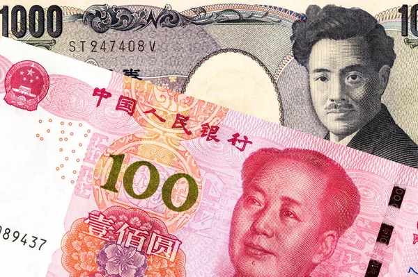 Japanese yen banknote and chinese yuan currency — Stock Photo, Image