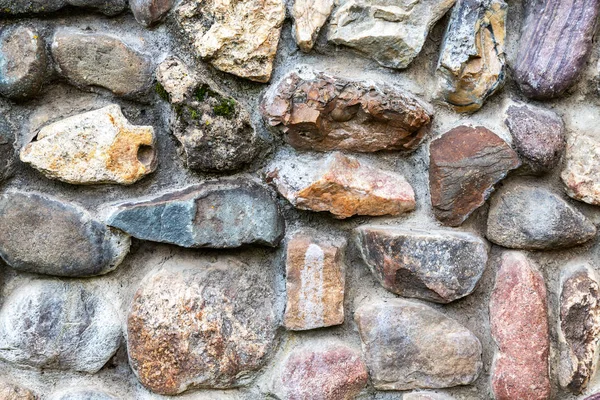 Weathered grunge rough stone wall as background texture — Stock Photo, Image