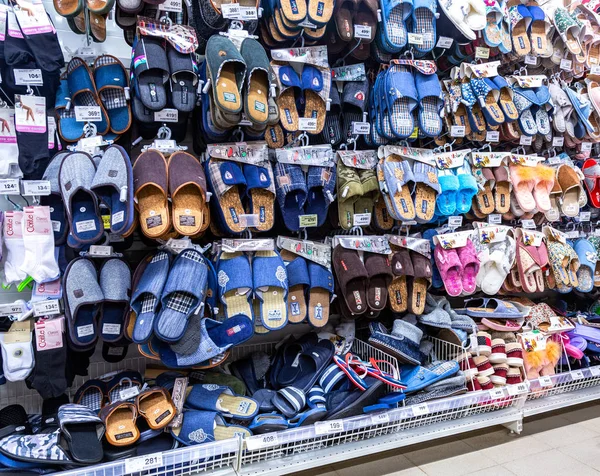 Different slippers selling at the showcase — Stock Photo, Image