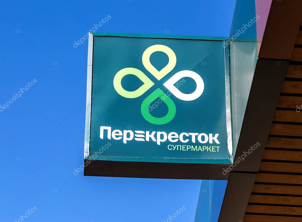 Samara, Russia - May 4, 2019: Emblem of a Perekrestok Store against a blue sky. Perekrestok is a Russian supermarket chain operated by X5 Retail Group