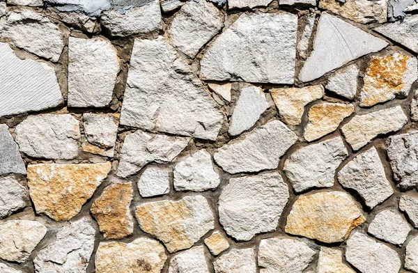 Weathered grey stone wall as creative background texture — Stock Photo, Image
