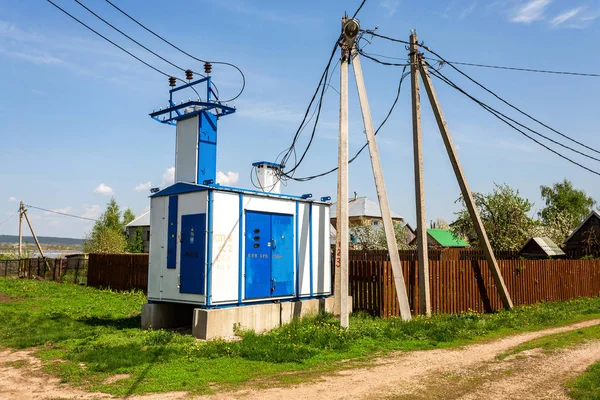 Voltage power transformer substation at the village — Stock Photo, Image