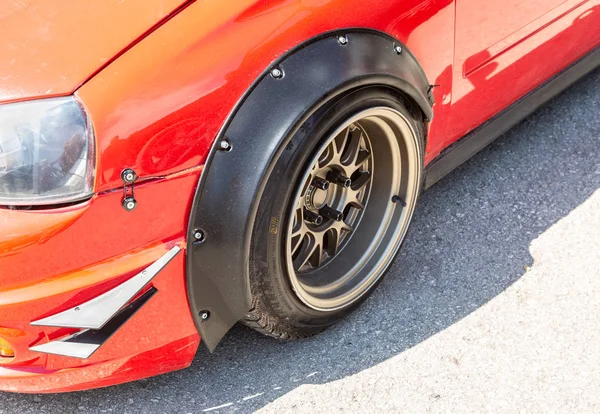 Modern tuned automotive wheel on metal disc — Stock Photo, Image