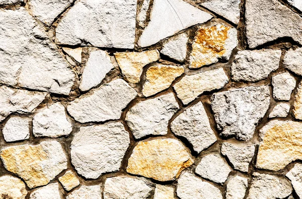 Parede de pedra resistente como textura de fundo — Fotografia de Stock