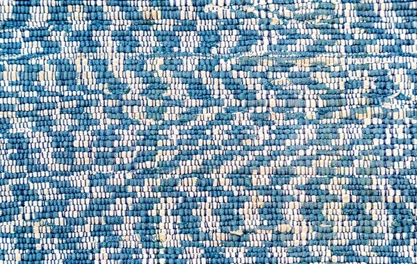 Textura de um tapete caseiro de tecidos diferentes — Fotografia de Stock