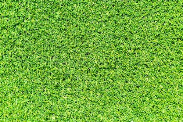 Césped verde artificial como textura de fondo — Foto de Stock
