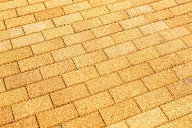 Arka plan dokusu olarak sarı seramik kaldırım taşları