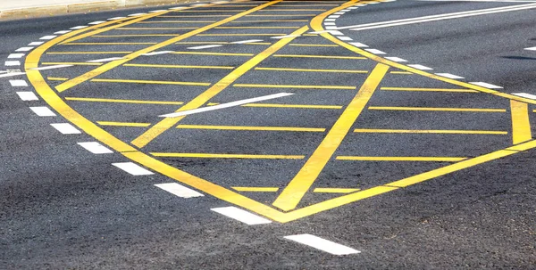 White and yellow road lines on the asphalt — Stock Photo, Image