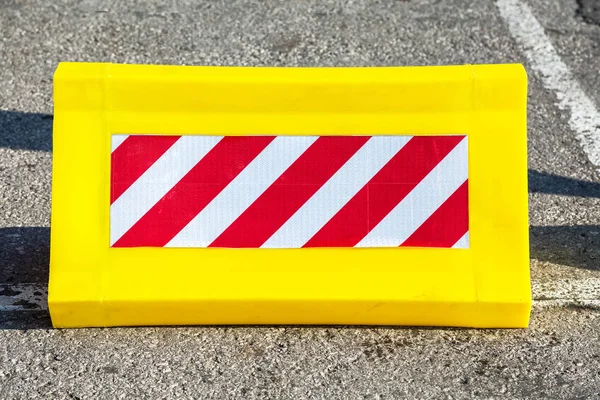 Road barrier with red and white striped caution pattern — Stock Photo, Image