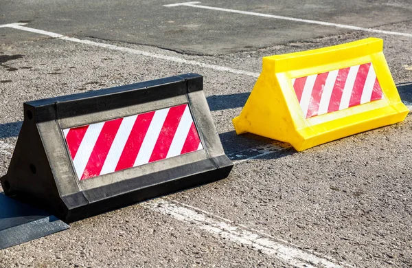 Road barrier with red and white striped caution pattern — Stock Photo, Image
