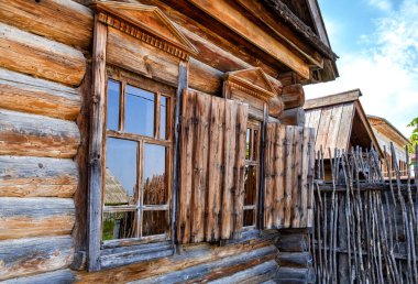 Traditional vintage russian timber house in the suburb of the Samara, Russia clipart