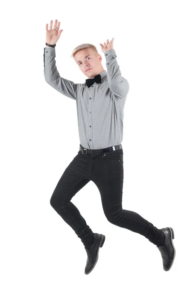 Handsome man in shirt and bow-tie jumping — Stock Photo, Image