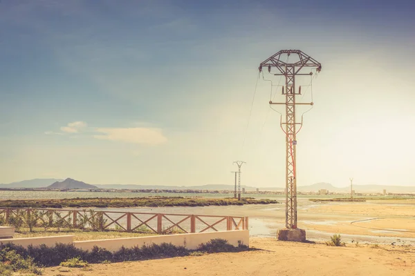 High voltage pole in the sea — Stock Photo, Image