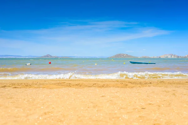 European sandy beach, boat and blue sea. — Stock Photo, Image