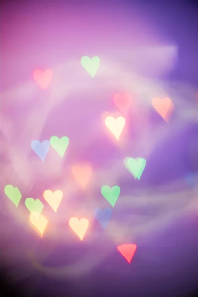 Defocused bokeh light hearts