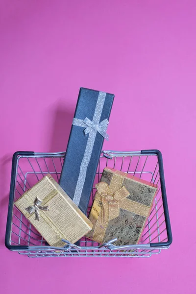 Christmas toys in shopping basket — Stock Photo, Image