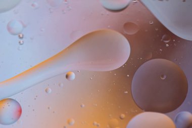 Turuncu ve gri arkaplan resmi yağ, su ve sabundan yapıldı