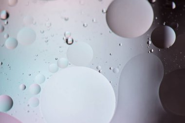 Odaklanmamış pastel ve koyu renkli soyut arkaplan resmi yağ, su ve sabundan yapıldı