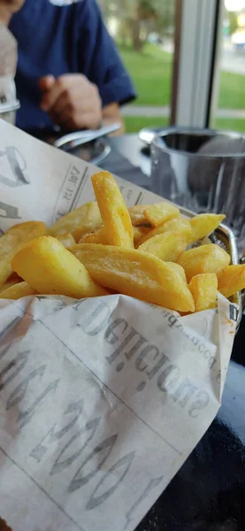 Home made fresh french fries on the table in restaurant.