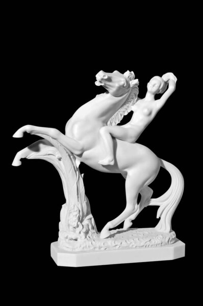 Classic marble statue of a girl on a horse on a black background