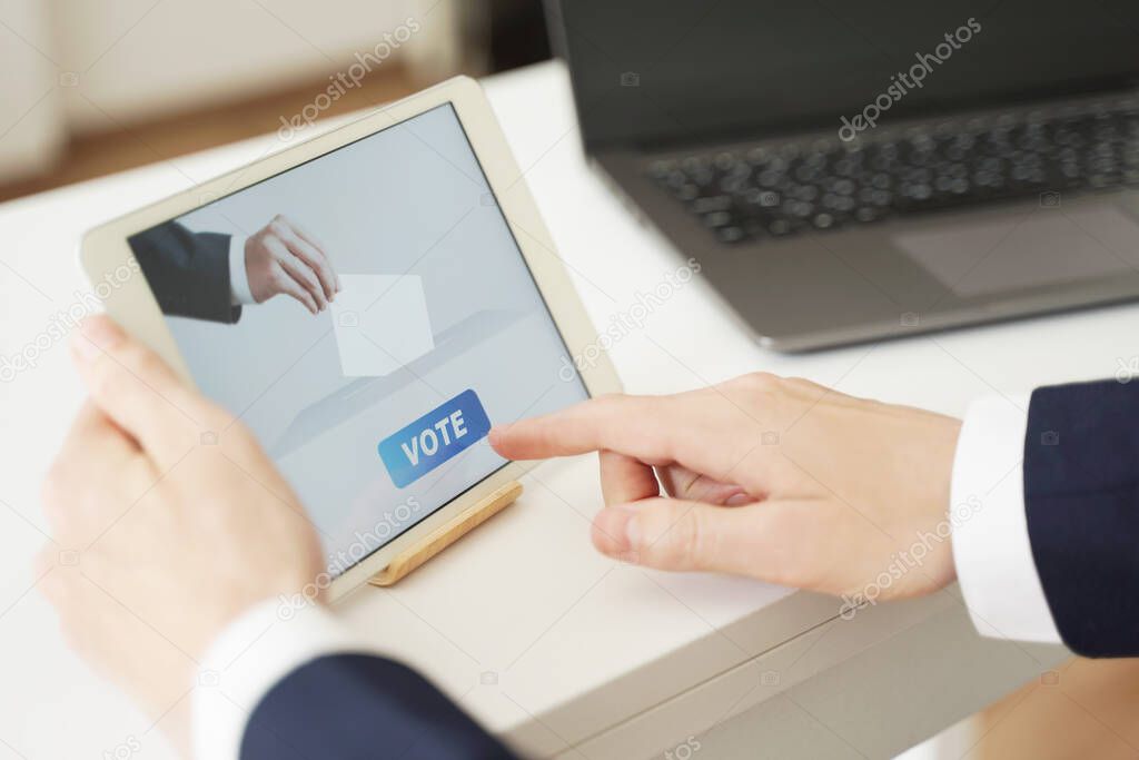 Businessman Voting Online from Office Using Digital Tablet.