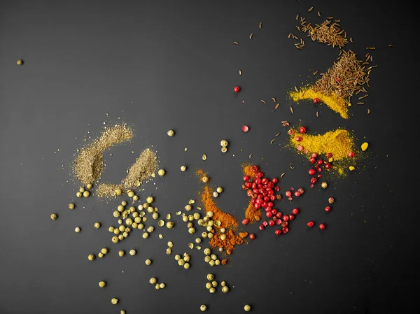 Various spices on black background — Stock Photo, Image