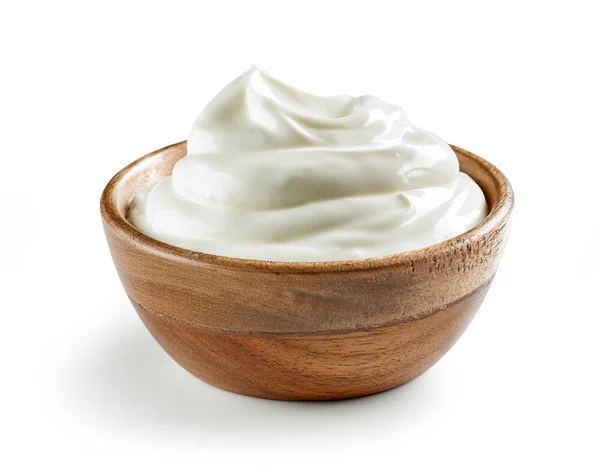Sour cream in wooden bowl Royalty Free Stock Images