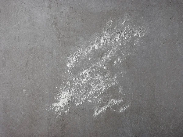 White flour on grey kitchen table — Stock Photo, Image