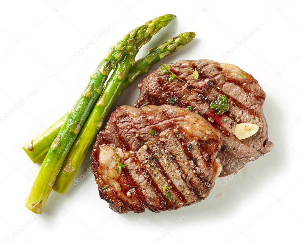 grilled steaks on white background